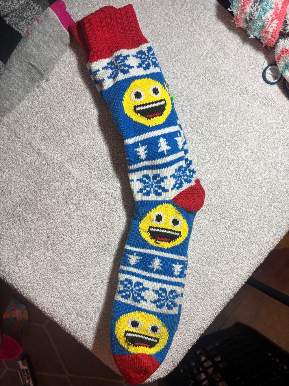 Source Unknown Blue Knit Holiday Stocking with Yellow Emoji and Red Trim